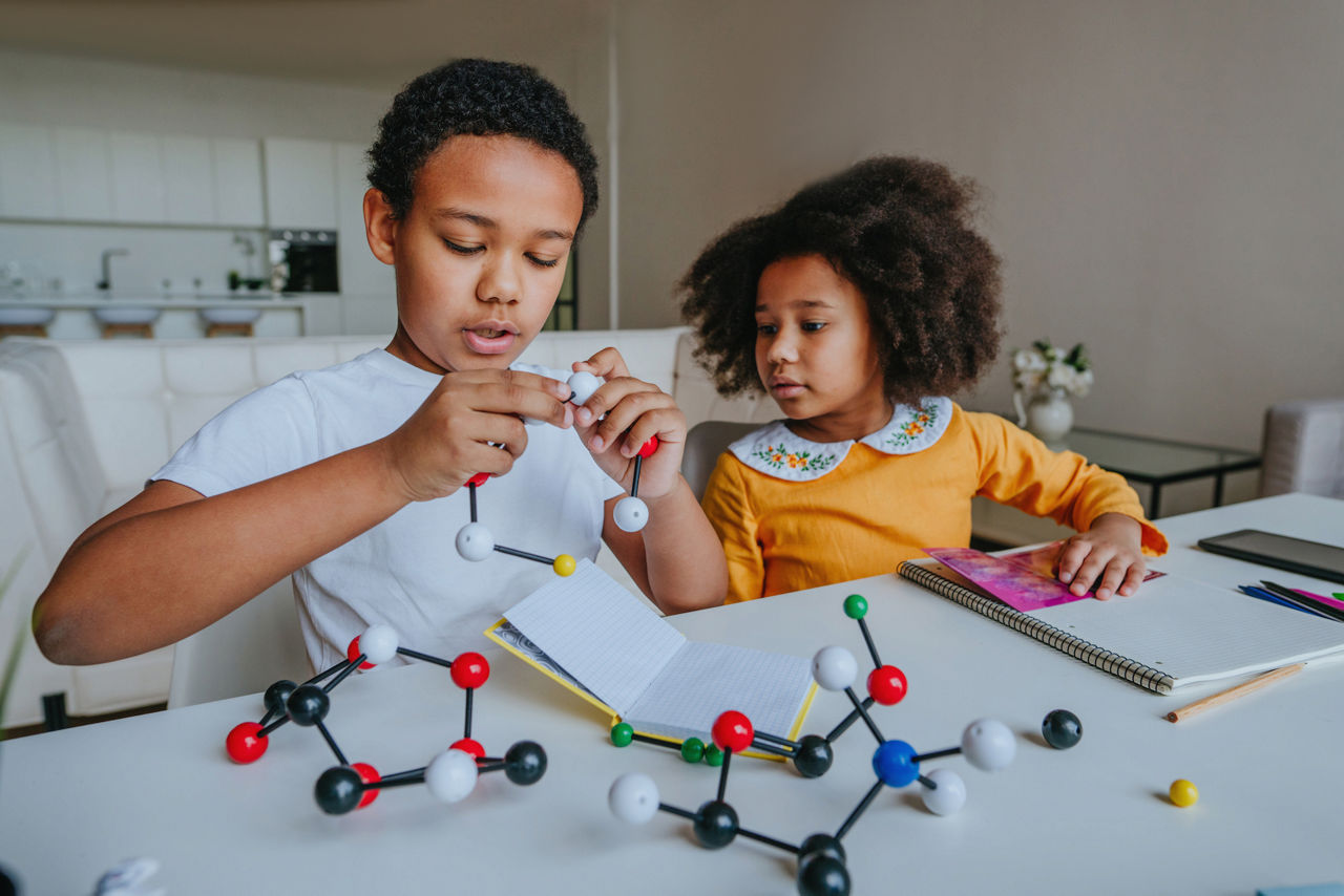 Boy and Girl Doing a Science Experiment at Home